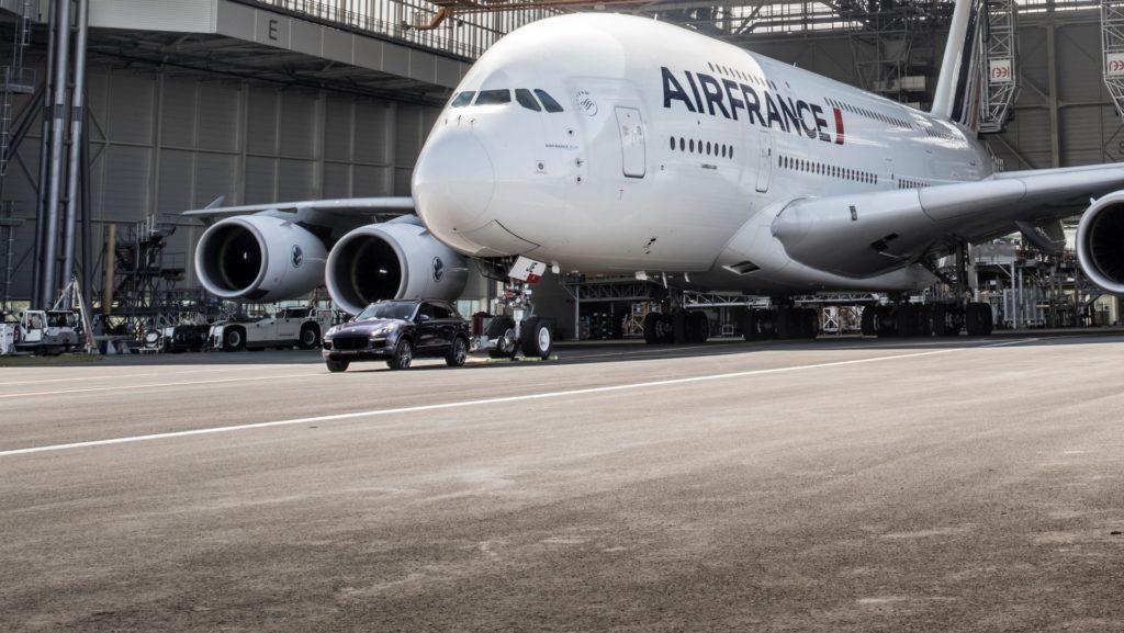 Porsche Cayenne S Diesel pulls one of Air France's 285 tonne A380 at Charles de Gaulle Airport in Paris - More Pull