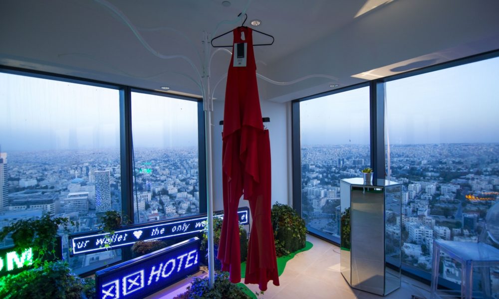 Cadillac Commissions Jordanian designer Nafsika Skourti To Fashion Piece - Red Outfit Hung