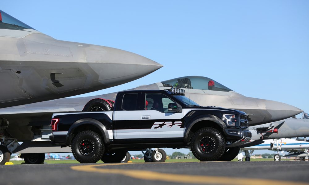 Ford F-150 Raptor F-22 Concept along side Lockheed Martin F-22 Raptor - Black Exterior - Front SideView