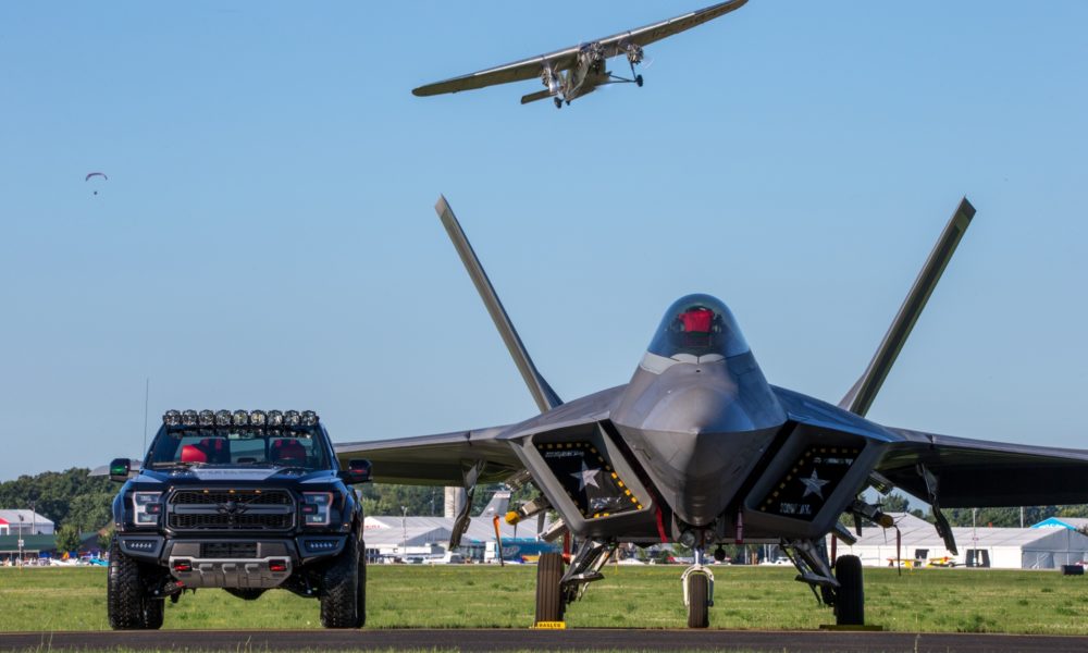 Ford F-150 Raptor F-22 Concept along side Lockheed Martin F-22 Raptor - Black Exterior - Front View
