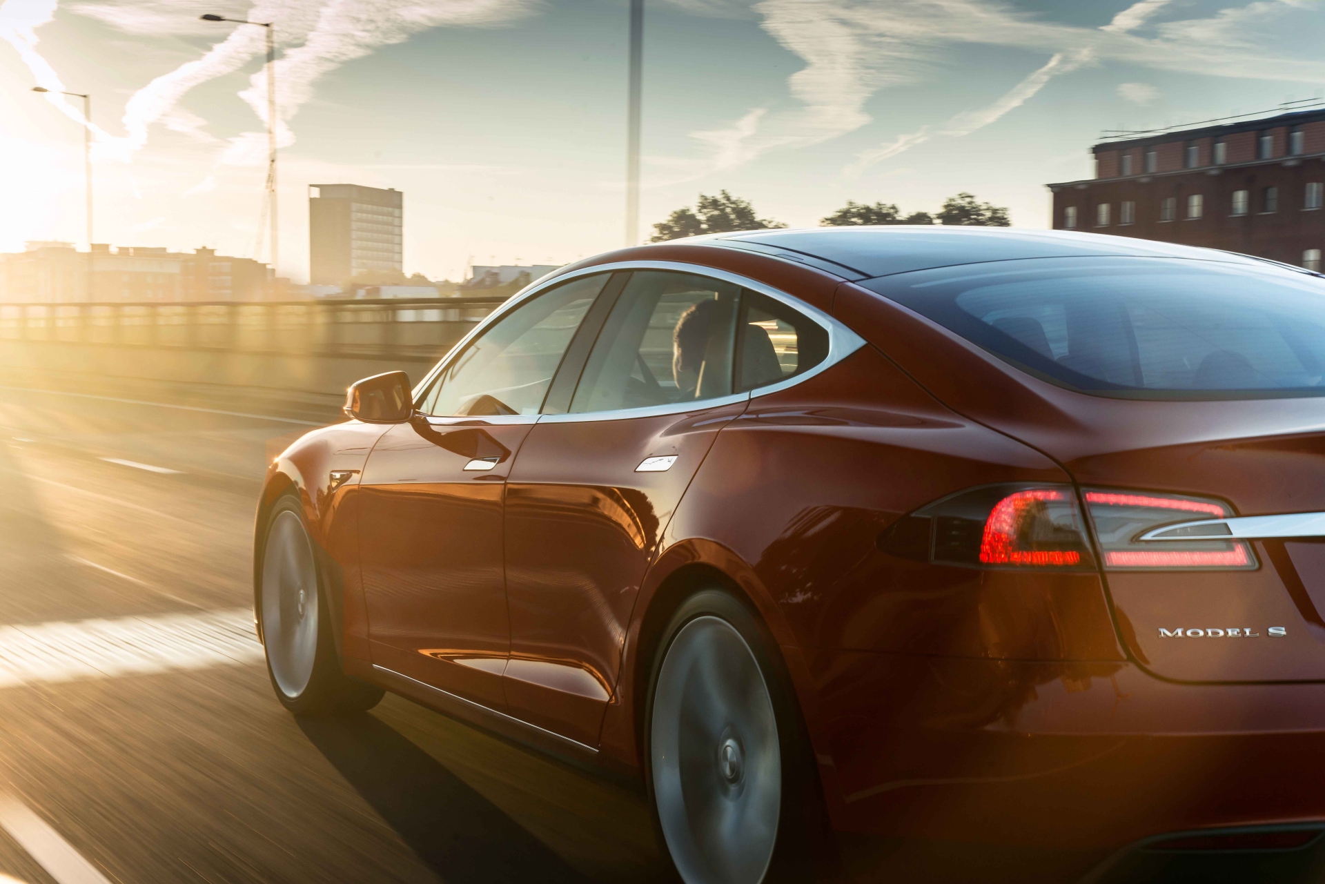Tesla Model S - Red Exterior - Rear Side View - Green Machine | A Closer Look At Electric Cars And Hybrid Vehicles