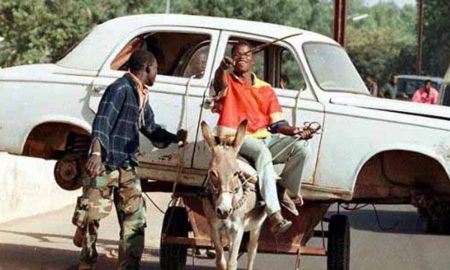 10 Vehicles Overloaded To A Point Of Being Ludicrous - Man on a mule carrying a car