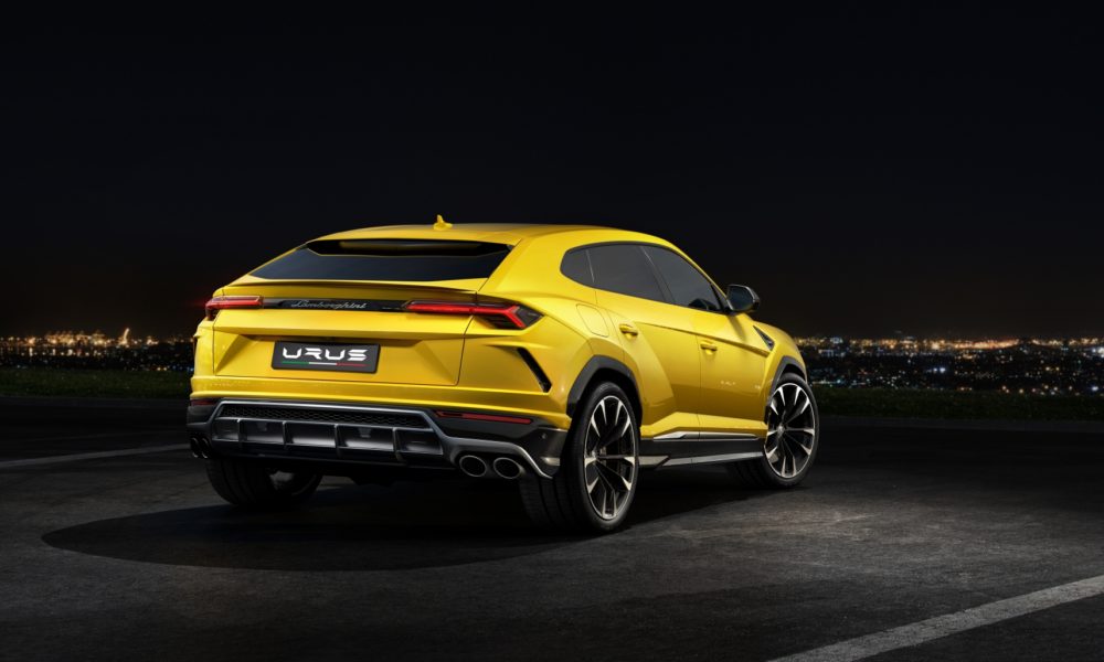 2018 Lamborghini Urus SUV - Yellow Exterior - Rear Side View - Black Background