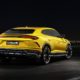 2018 Lamborghini Urus SUV - Yellow Exterior - Rear Side View - Black Background
